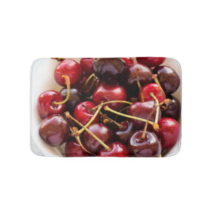 Schüssel mit Kirschen Badematte