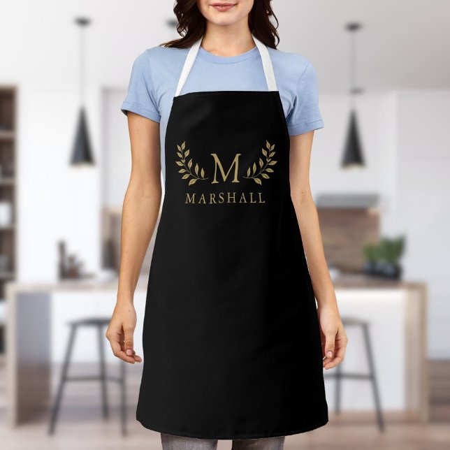 Schwarz und Gold Moderne elegante Floral Monogram  Schürze (Black And Gold Modern Elegant Floral Monogram Name Apron)
