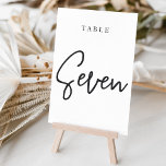 Schwarz-Weiß-Hand-Drehtisch SIEBEN Tischnummer<br><div class="desc">Einfache und schicke Tischnummer-Karten in Schwarz und Weiß machen bei Ihrer Hochzeit oder Veranstaltung ein elegantes Statement. Das Design bietet "table [number]" in einem spannenden Mix aus klassischen Serifen und handgeschriebenen Skripten. Design wiederholt sich auf beiden Seiten. Einzelne nummerierte Karten werden separat verkauft; bestellen Sie jede Tischnummer einzeln aus unserer...</div>