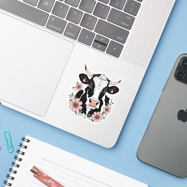 Schwarz-Weiß-Kuh mit Blume Aufkleber (Laptop mit iPhone)