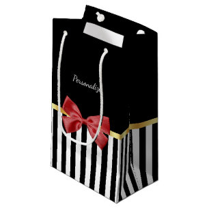 Schwarz-Weiß-Streifen mit kleinem roten Bogen und Kleine Geschenktüte