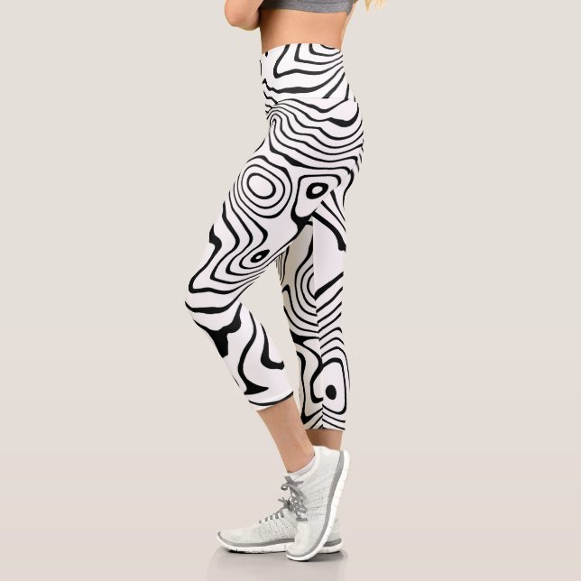 Schwarz-weiße flüssige Verwirbelung Capri Leggings (Links)