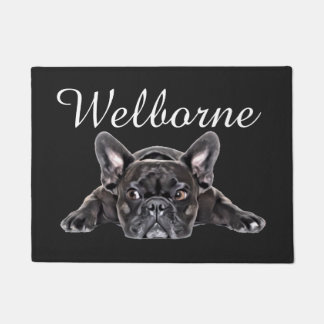 Schwarz-weißer französischer Bulldog-Welpe, der ge Fußmatte