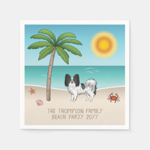 Schwarz-weißer Papillon-Hund am tropischen Sommers Serviette