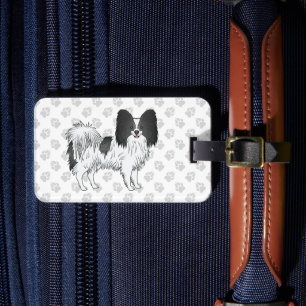 Schwarz-weißer Papillon-Hund mit individuellem Tex Gepäckanhänger