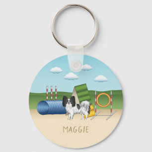 Schwarz-weißer Papillon mit Agility-Ausrüstung Schlüsselanhänger