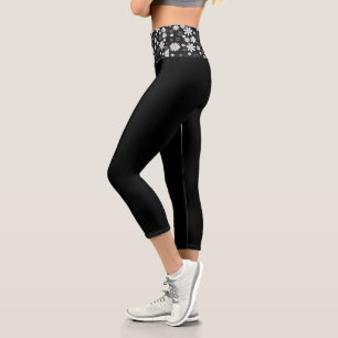Schwarze Caprihose mit weißen Gänseblümchen und ho Capri Leggings
