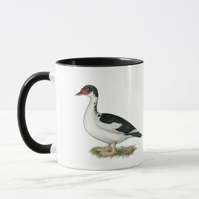 Schwarze gescheckte Ente Muscovy Tasse (Links)