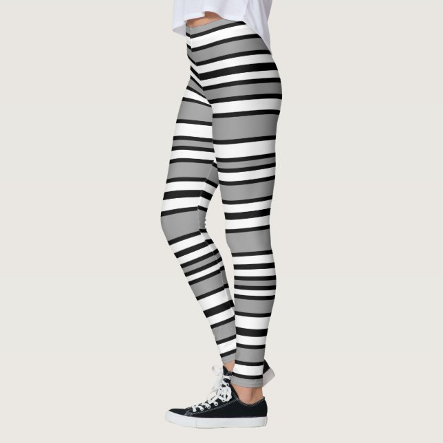 Schwarze, graue und weiße Streifen Leggings (Links)