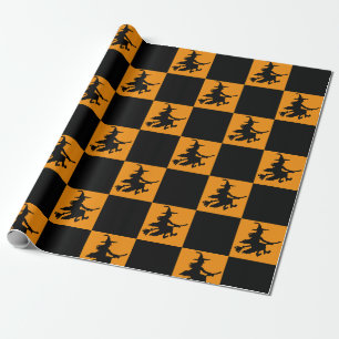 Schwarze Hexen auf orange kariertem Geschenkpapier