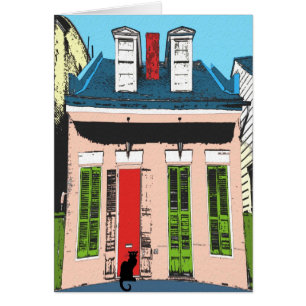 Schwarze Katze an der rosa Hütte