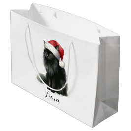 Schwarze Katze auf festlichem Weihnachtsmannmütze Große Geschenktüte