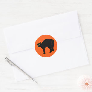 Schwarze Katze auf Orange Runder Aufkleber
