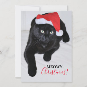 Schwarze Katze mit roter Weihnachtsmannmütze Feiertagskarte