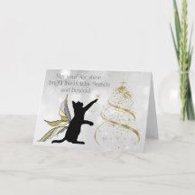 Schwarze Katze und dekorativer Goldbaum