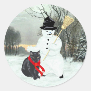 Schwarze Katze und Schneemann Runder Aufkleber