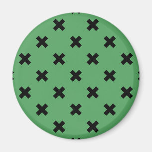 Schwarze Kreuzstiche auf grün Magnet