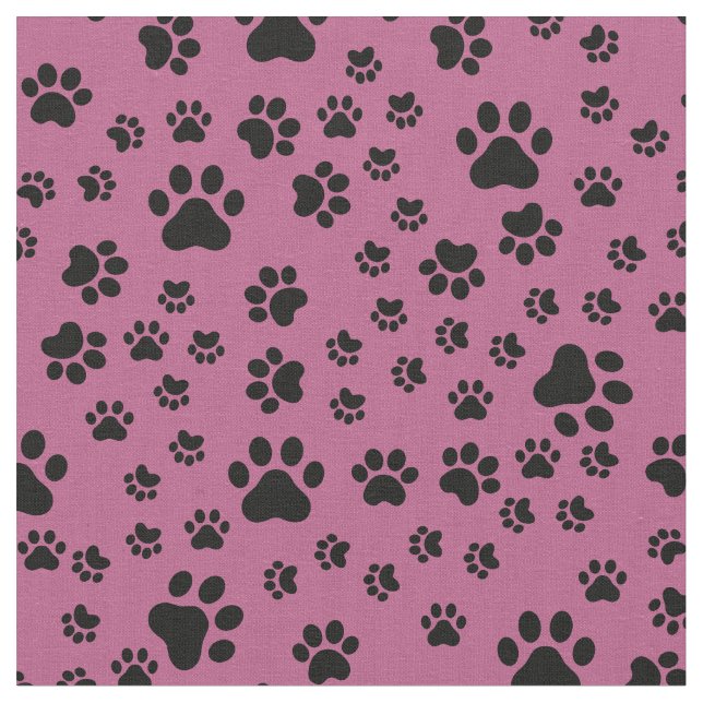 Schwarze Paw-Prints auf Rosa Stoff (Nahaufnahme)