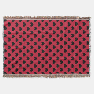 Schwarze Polka Herzen auf rot Decke