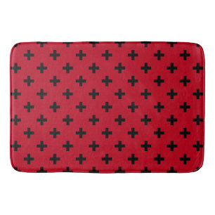 Schwarze Polka Kreuze auf rot Badematte