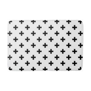 Schwarze Polka-Kreuze auf Weiß Badematte