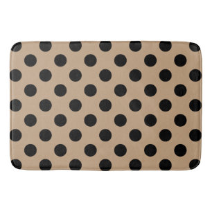 Schwarze Polka-Punkte auf Beige Badematte