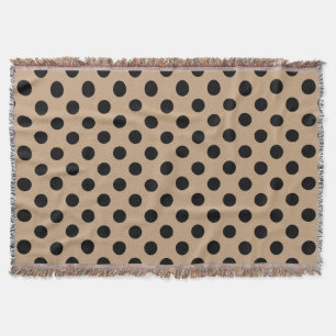 Schwarze Polka-Punkte auf Beige Decke