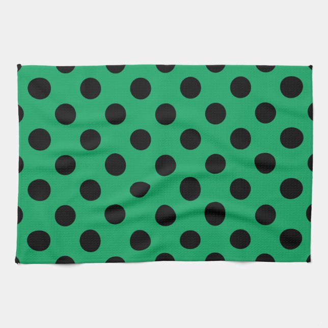 Schwarze Polka Punkte auf frisch grünem Geschirrtuch (Horizontal)