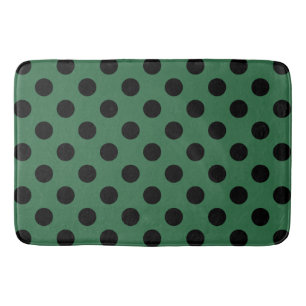 Schwarze Polka-Punkte auf kelgrün Badematte