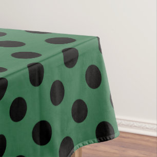 Schwarze Polka-Punkte auf kelgrün Tischdecke