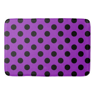 Schwarze Polka Punkte auf lila Badematte