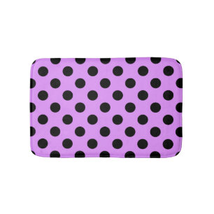 Schwarze Polka-Punkte auf Lila Badematte