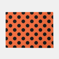 Schwarze Polka-Punkte auf Orange