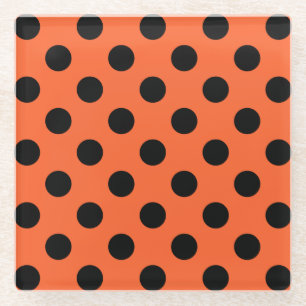 Schwarze Polka-Punkte auf Orange Glasuntersetzer