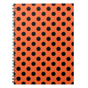 Schwarze Polka-Punkte auf Orange Notizblock