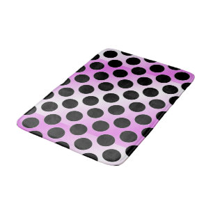 Schwarze Polka-Punkte auf Rosa Badematte
