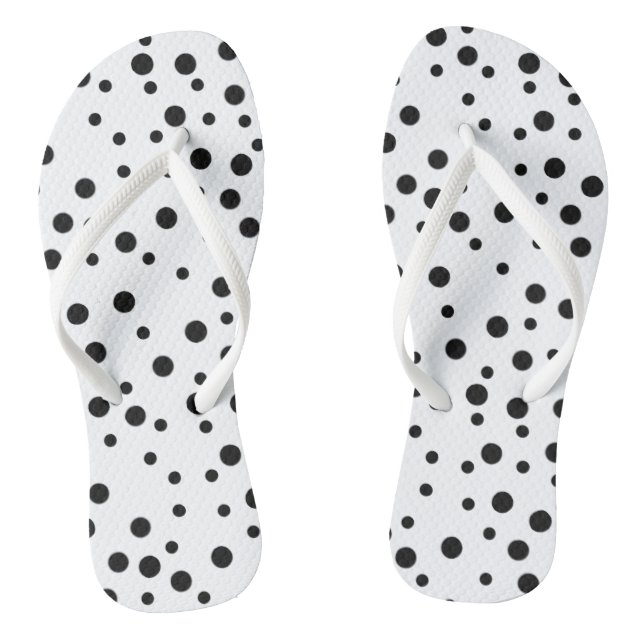 Schwarze Polka Punkte auf weißen Flipflops (Fußbett)