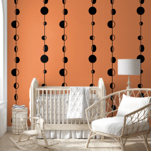 Schwarze Punkte und senkrechte Linien auf Orange Tapete