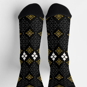 Schwarze Socken mit einem goldenen und weißen Must