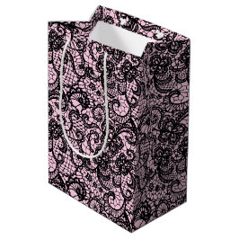 Schwarze Spitze auf rosa Mittlere Geschenktüte