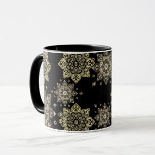 Schwarze Tasse mit Goldmedaillen