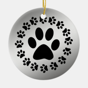 SCHWARZE TATZEN AUF SILBERNER VERZIERUNG KERAMIK ORNAMENT