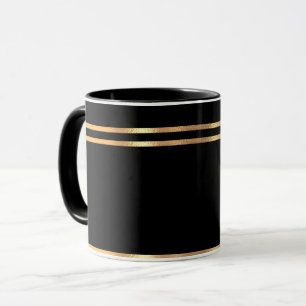 Schwarze und goldene Tasse