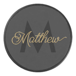 Schwarze und goldene Typografie Hinzufügen von Nam Eishockey Puck