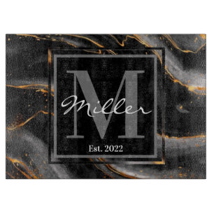 Schwarze und goldmarmorierte, frisch gezogene Häu Schneidebrett