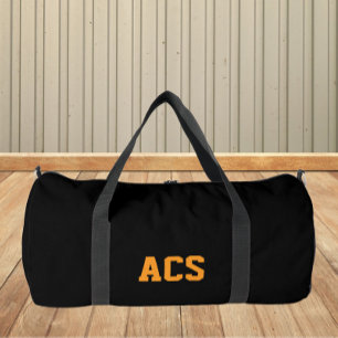 Schwarze und orangefarbene Schulfarben und Buchsta Duffle Bag
