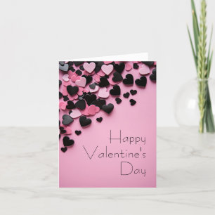 Schwarze und rosa Herzen auf rosa Erde Valentinin Feiertagskarte