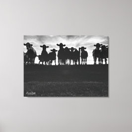 Schwarze und weiße Kühe am Zaun Leinwanddruck