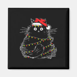 Schwarze Weihnachtsmannkatze, verheddert in Weihna Magnet