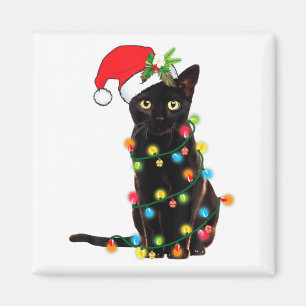 Schwarzer Katzen-Weihnachtsmann, verheddert in Wei Magnet
